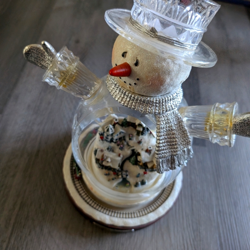 Snow man with light and small train